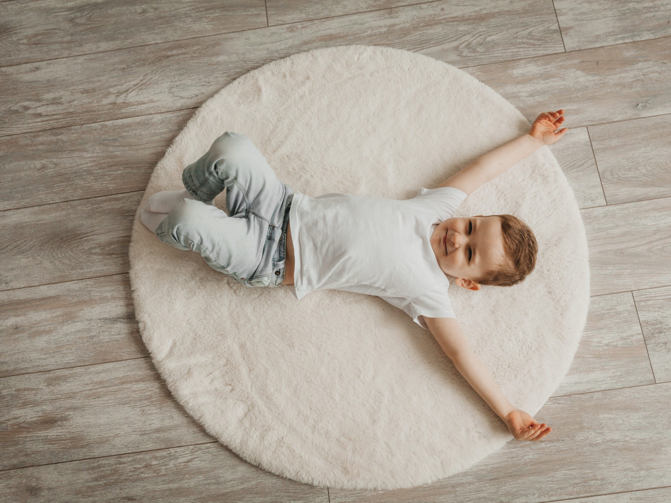 Little boy lying at home