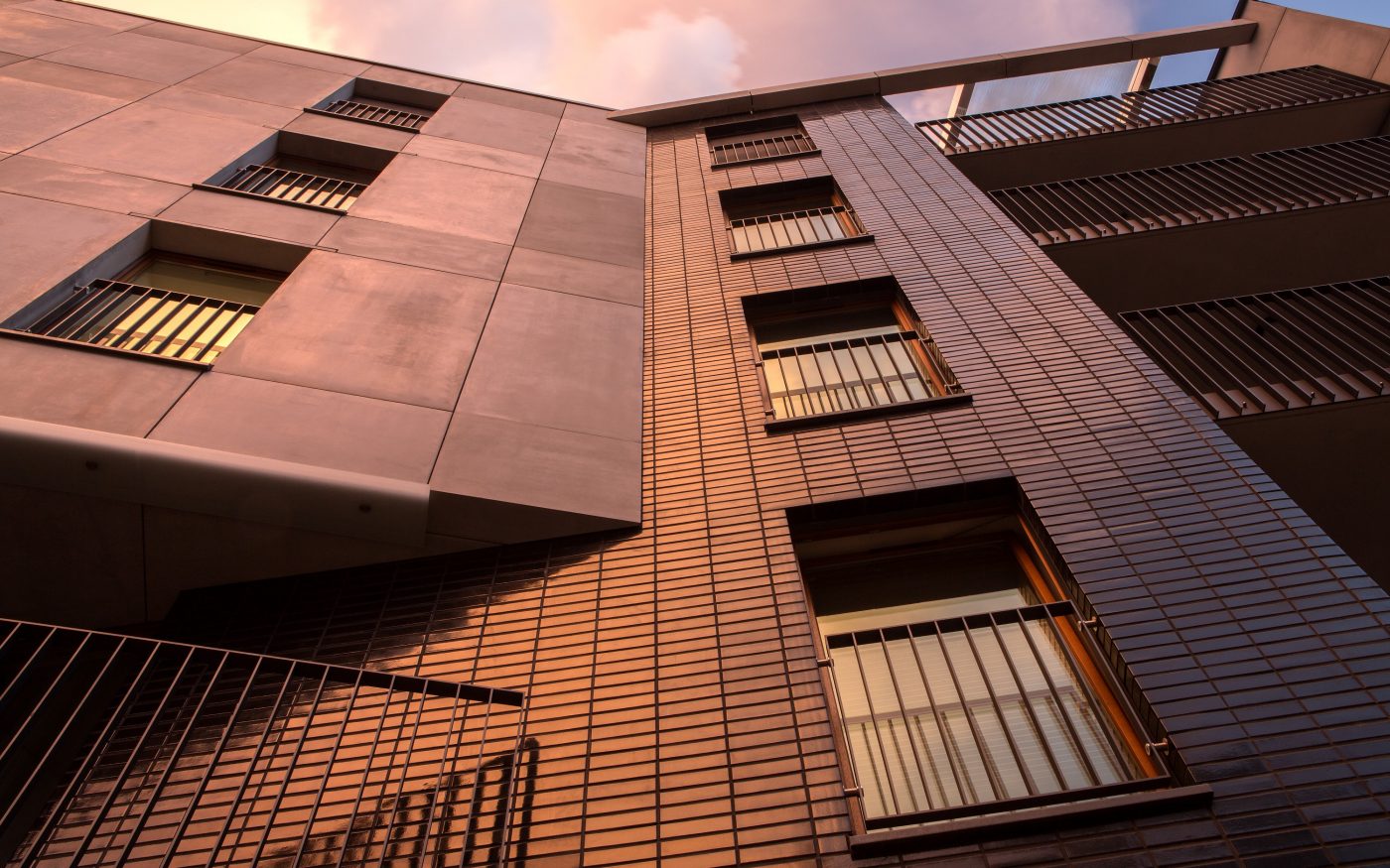 Multifamily setting with black glazed facing brick slips in Crakow