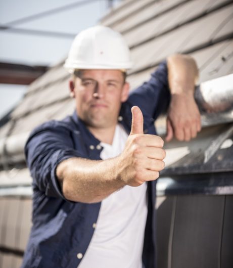 Blurry roofer presenting his crisp thumb 