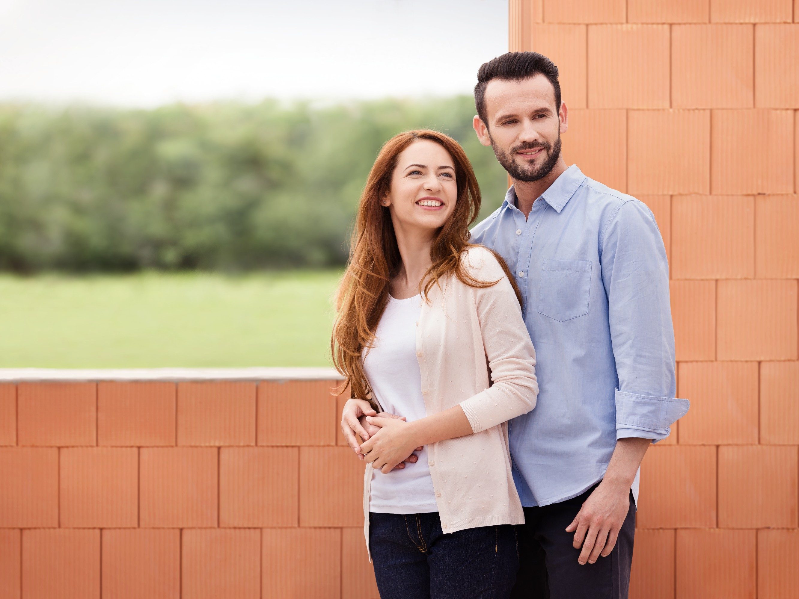 Couple inside their future home inside building shell