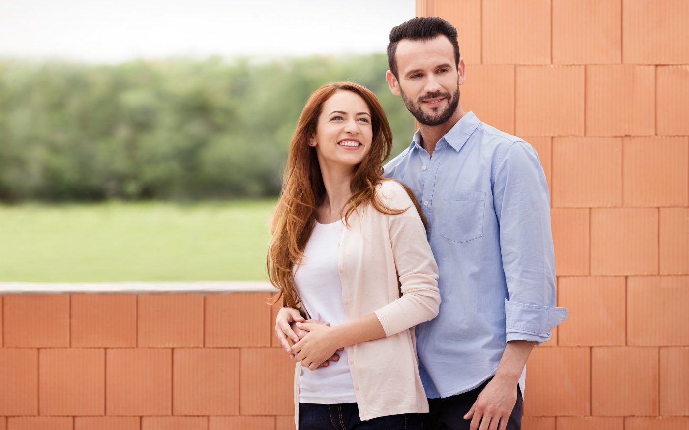 Couple inside their future home inside building shell