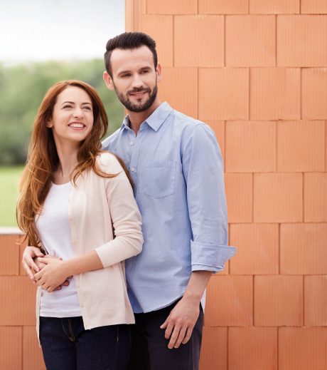 Couple inside their future home inside building shell